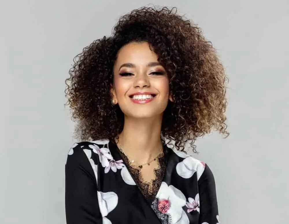 black with red lipstick, flower dress and naturally curly hair