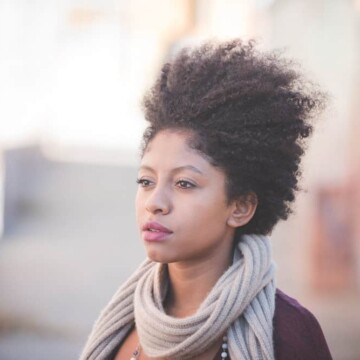 Cute black girl with healthy hair that's considering taking MSM powder for natural hair growth