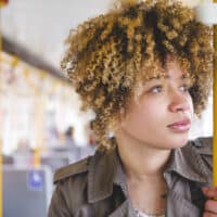 Black woman with poofy hair strands