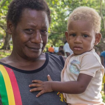 Portrait of a Melanesian kid with his father.