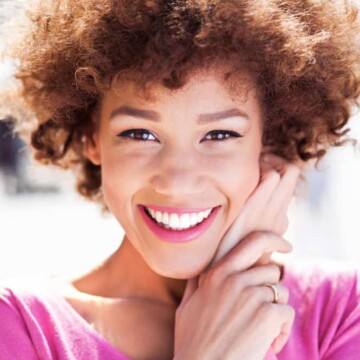 black girl with purple dye on dark hair