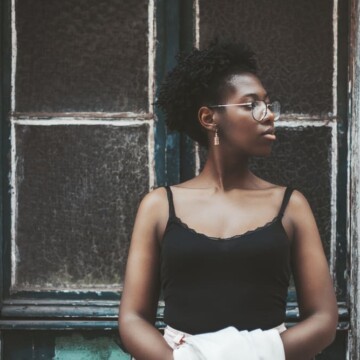 Charming black girl with starter locs