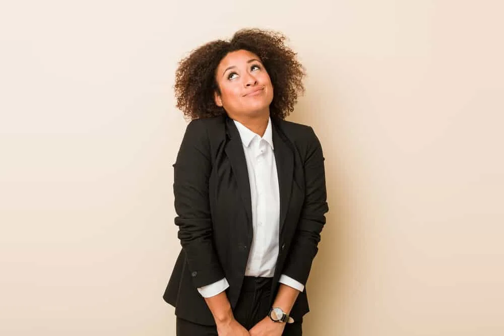 Cute black woman wearing a blue sports coat and white dress shirt