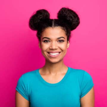 African American female with curly space buns