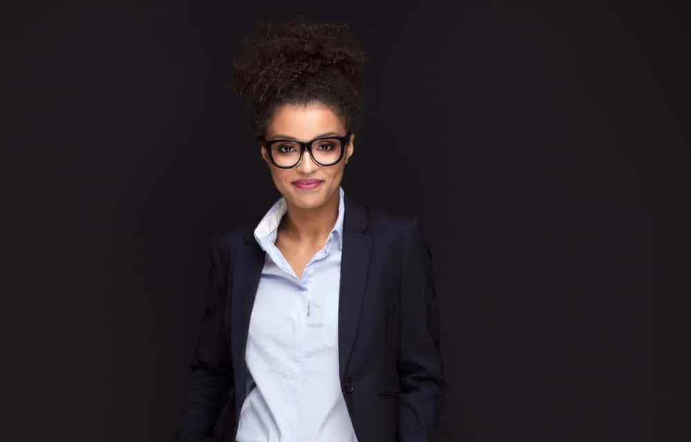 Cute young woman with short hair in a pineapple half-pony hairstyle 