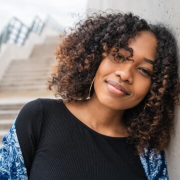 Black girl with curly hair after using the cherry lola treatment