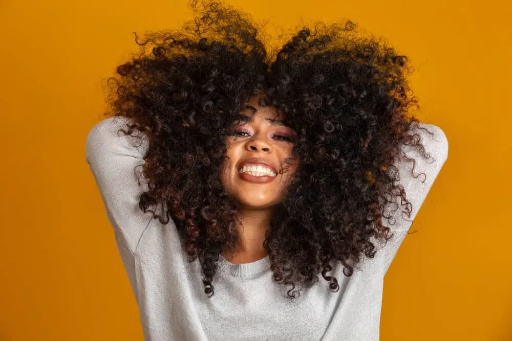 Cute African American female wearing clip-in extensions 