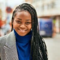 young black lady wearing thin sisterlocks