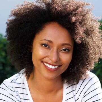 African American female outside in the sunlight where you can see the brown eumelanin and the black eumelanin