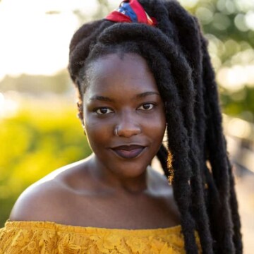 black lady with wick dreads