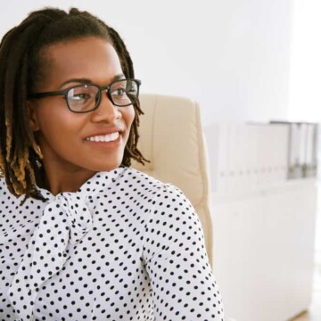 African American lady with black and brown dreads