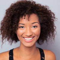 Black female with thick hair density wearing organic skin and hair products to avoid hair lank and silicone buildup.