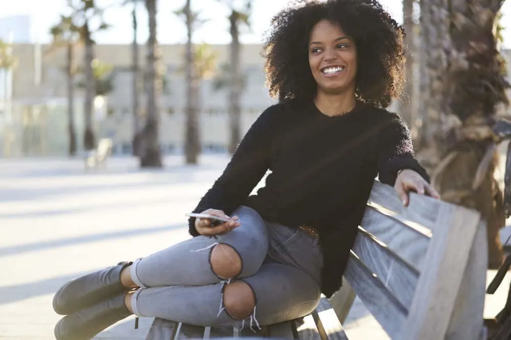 Black female with fine hair wearing a wash n go style created with essential oils and aloe vera gel.