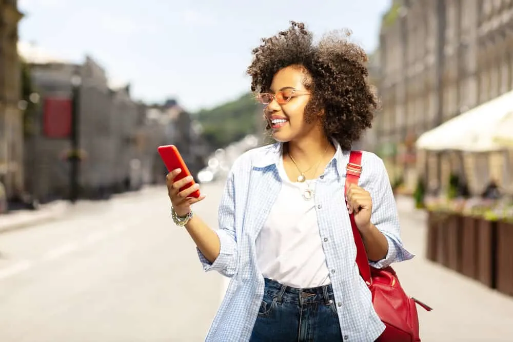 Young girl taking a tour around downtown Birmingham while her hair absorbs the sun's UVB rays.