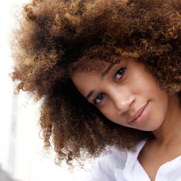 Beautiful young African American woman with color-treated hair dyed with Ion Color Brilliance Brights dye.