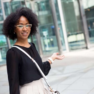 Young African American lady with healthy hair wearing a curly twist-out hair style on a 4B hair type.