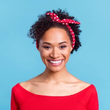 Adorable sweet black girl with 3B natural hair using the Curly Girl Method to support her hair health.