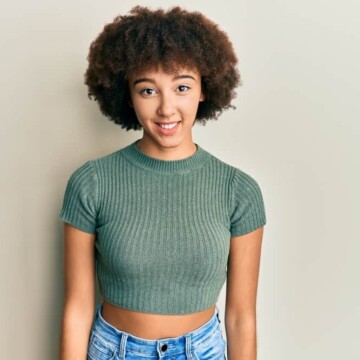 Young Hispanic girl with naturally curly healthy hair wearing a wash n go after leaving the hair stylist.