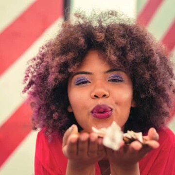 Cute black girl with bleached hair that has been dyed with brown and purple demi-permanent hair dyes.