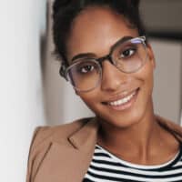 African American female with clear skins for using a benzoyl peroxide treatment and topical antibiotics.