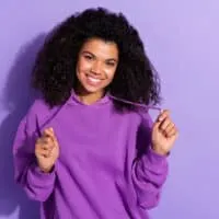 Young African American female wearing a wash and go after using Head and Shoulders shampoo.