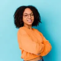 Cute African American female with 3C curls treated with Irish sea moss and olive oil to promote hair growth.