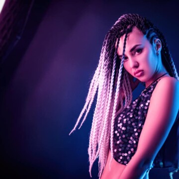 Cute Thai girl wearing a Thai traditional hairstyle with braided hair that's uncommon among non-black people.