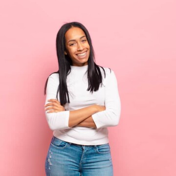 Young African American female with straight hair strands created with a hair straightener on type 4 fine hair.