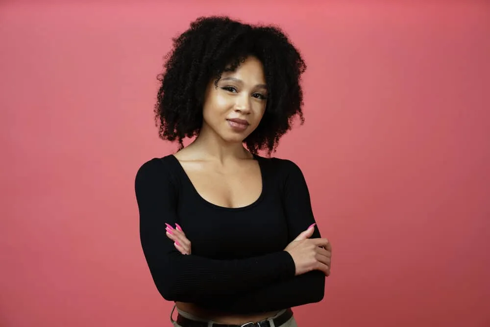 African American female with dry and brittle hair due to using protein hair products with too much keratin.