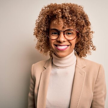 Beautiful African American female that dyed her own hair reddish-brown with box hair dye pigments.