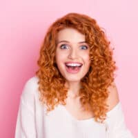 Cute white lady with thick hair after using African American hair dye and Care-free Curl Gold coconut oil.