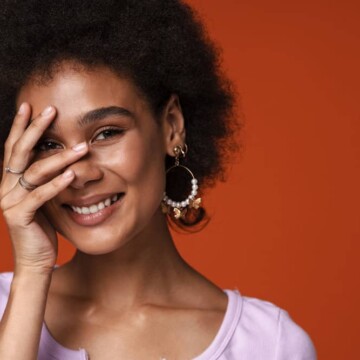 Young African American female after getting a bond realignment treatment to strengthen hair follicles.