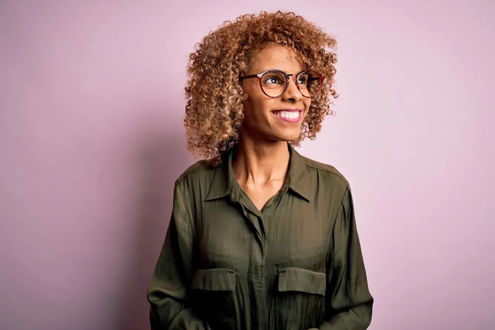 Cute young black girl wearing a semi-permanent hair color that often lasts up to twenty washes.