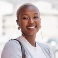 Cute African American female with a light-brown skin tone and a TWA hair length that requires minimal styling.