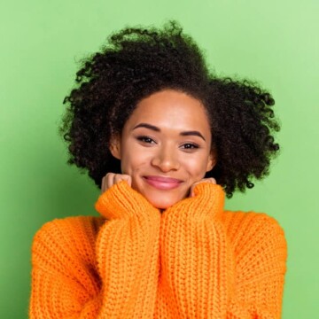 Pretty young African American female wondering what's making her dark brown natural hair lighter.