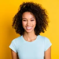 Gorgeous African American female with dark brown bleached hair includes natural and artificial pigments.