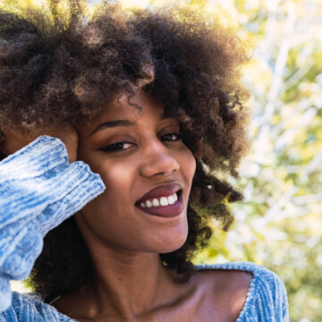 African American female with high porosity hair strands, a 4C hair texture on curly, and curly hair cuticles.