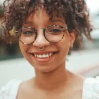 A black female with wavy hair after using the Curly Girl Method had very straight hair as a child (e.g. baby hair).