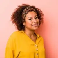 Young African American female with a dark brown natural hair color that's been dyed with Splat hair color.