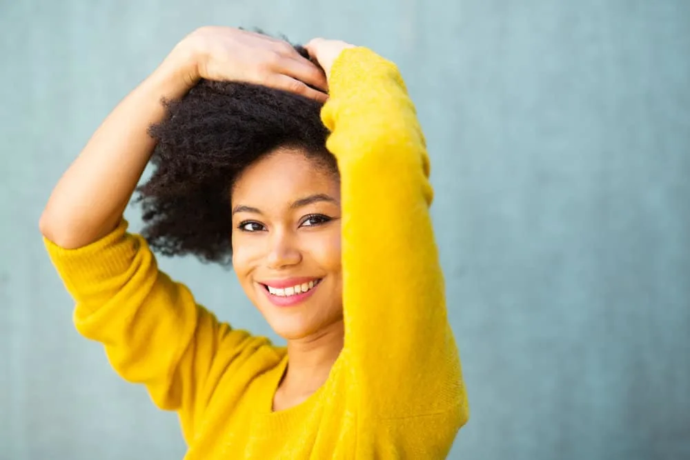 A light-skinned black female with a 4B curl definition according to Andre Walker after taking down bantu knots.