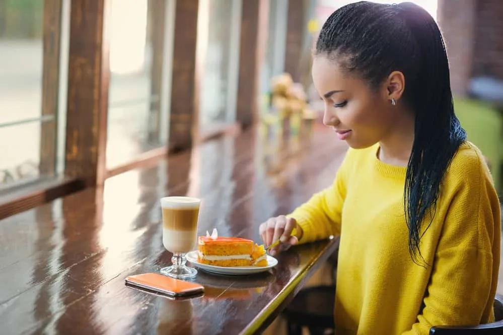 A young black woman with thick hair is starting to see some traction alopecia due to a flawed DIY locking method.