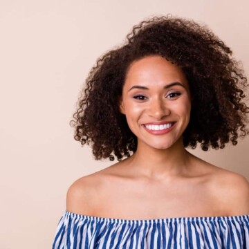 Cute black female with dark brown, fine hair that has been dyed a darker shade with medium brown hair dye.