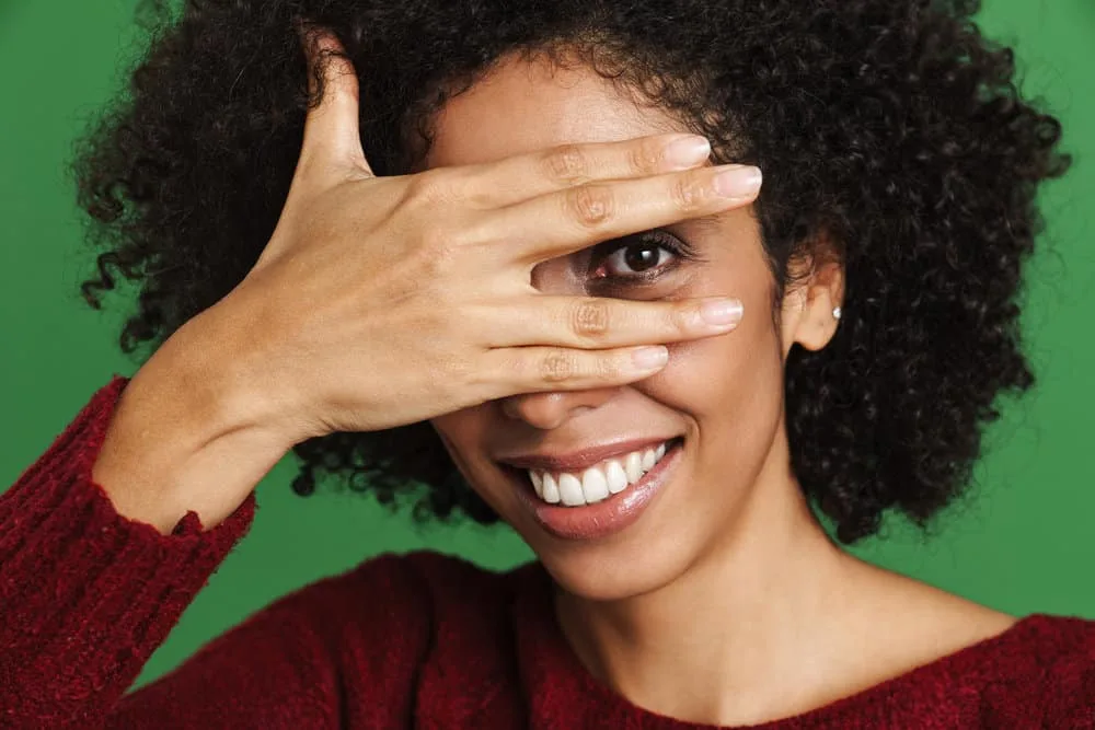 A woman with protein-overloaded hair added a hydrating conditioner to her hair care routine to add moisture.