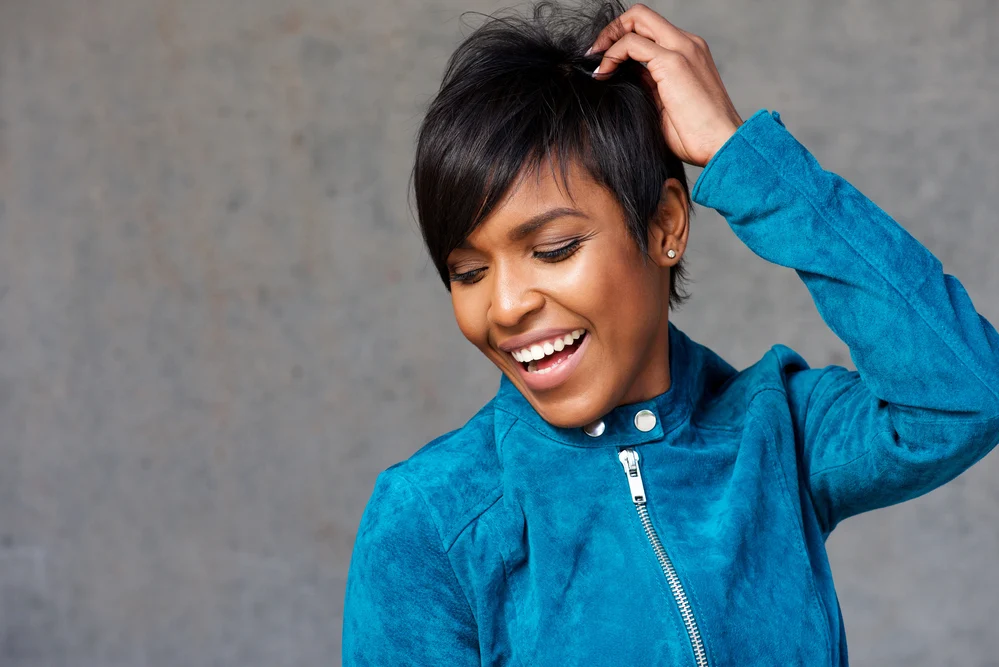 An attractive young black woman decided not to blow dry her wet strands in order to allow her hair to dry naturally.