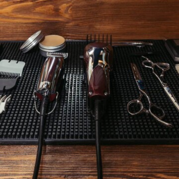 A barbershop mat is showing ceramic clipper blades that were recently purchased from the beauty supply store.