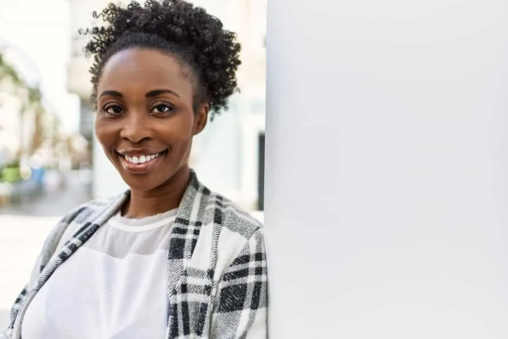 African American woman transformed her dark hair from brown to a striking deep black color.