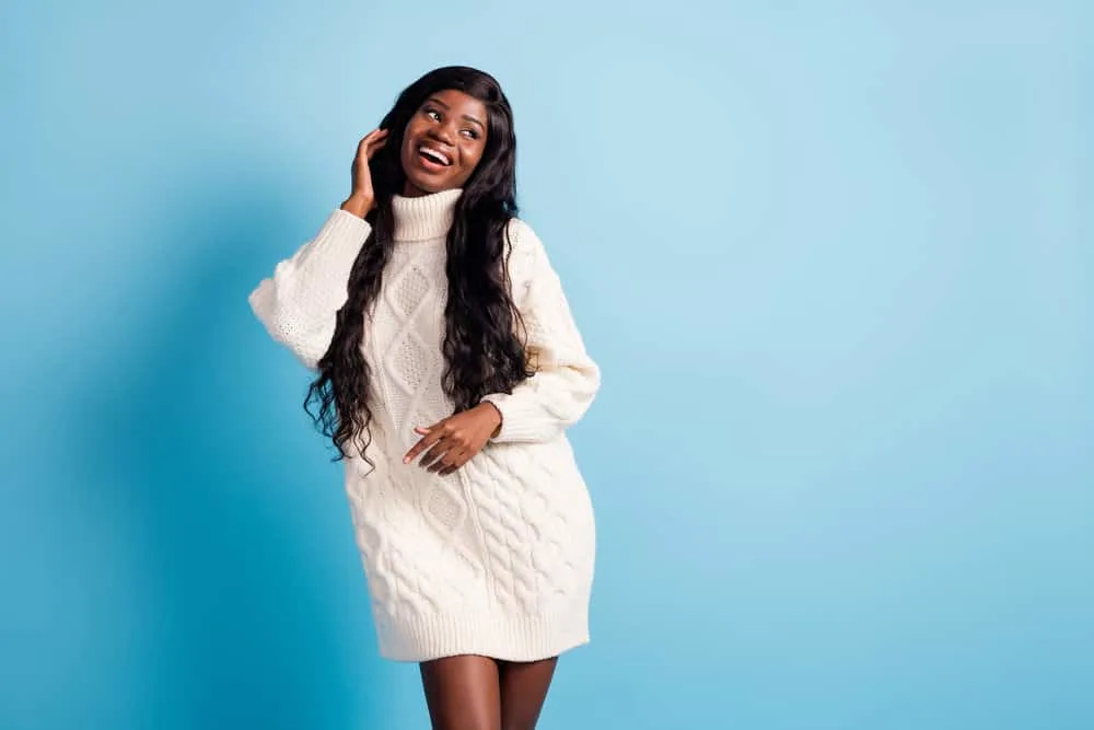 An adorable young African American female wearing a lace wig with type 4 hair densities with a natural look.