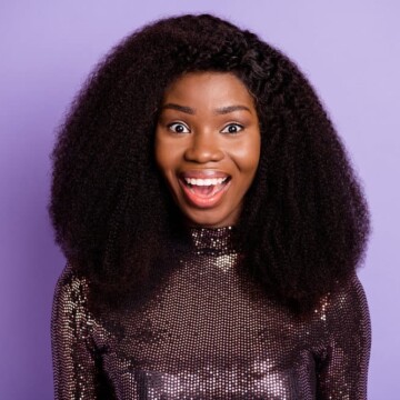 A black woman wearing a lace closure wig made from human hair using a flat and seamless installation.