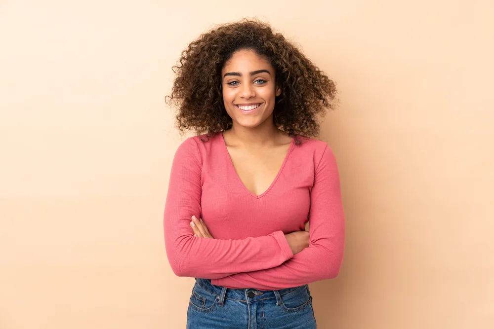 A lady wearing a dark brown hair color moisturized with a mixture of lavender oil and tea tree oil.