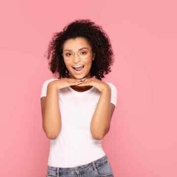 A black woman styled her curly hair with old argan oil and other expired hair products.